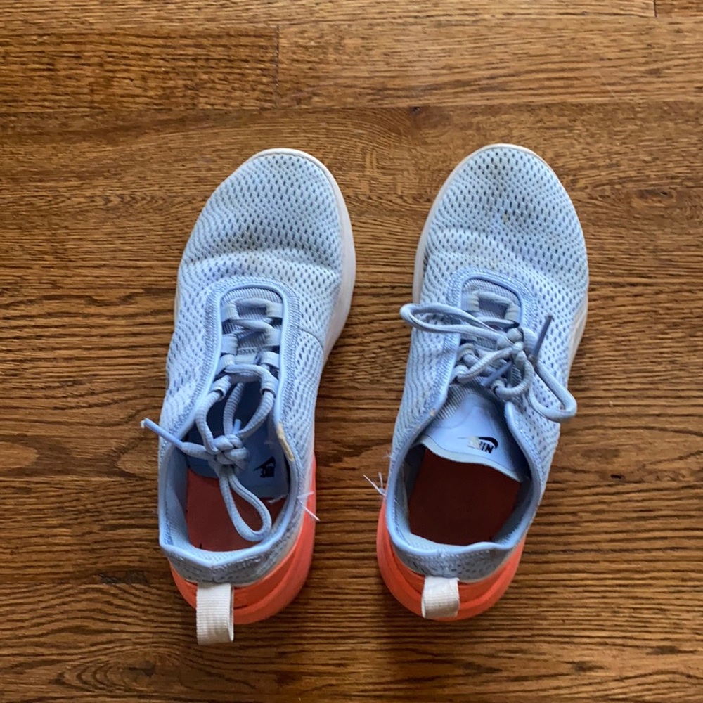 Nike light blue with orange and white on bottom.